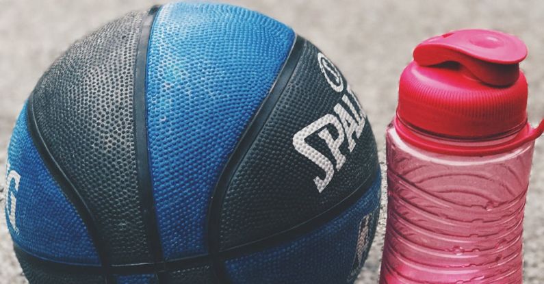 Stay Hydrated - Photo of Basketball Near Pink Water Bottle