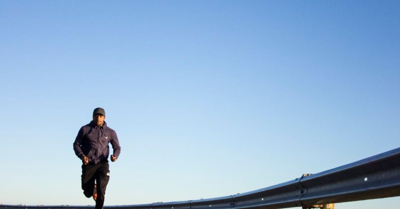 Endurance Sports - Photo Of Man Running During Daytime