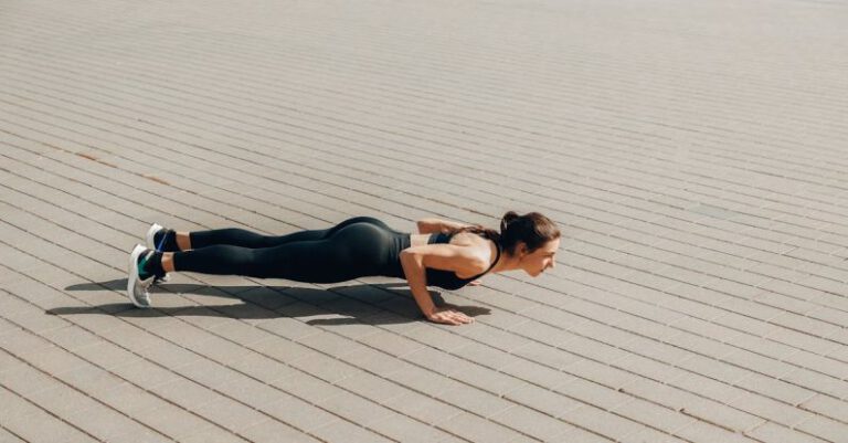 Bodyweight - A Woman in Activewear Doing Push Ups