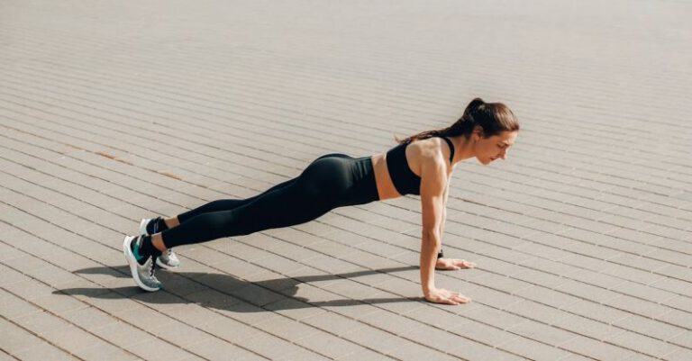 Bodyweight Exercises - A Woman in Activewear Doing a Push Up