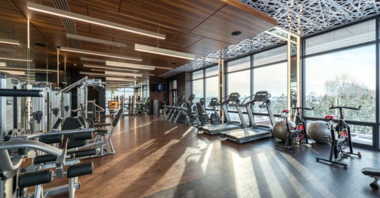 Cardio Machines - Interior of modern fitness club with various machines and equipment