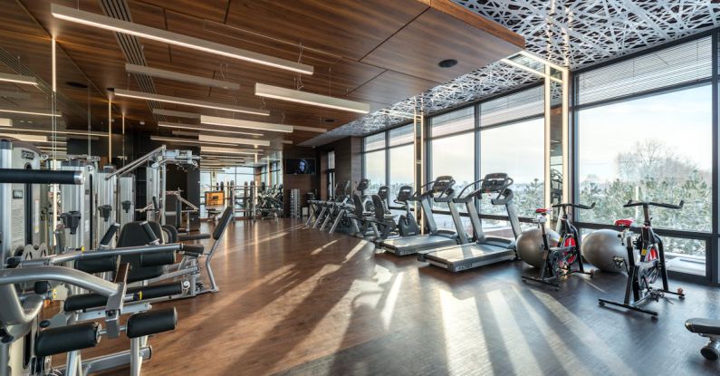 Cardio Machines - Interior of modern fitness club with various machines and equipment