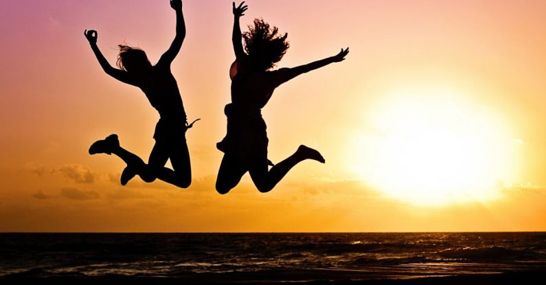 Active - Silhouette Photography Of Jump Shot Of Two Persons